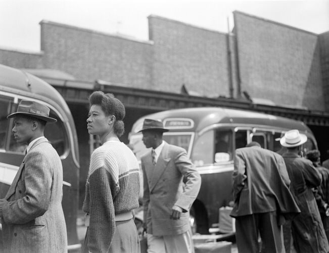 Evelyn Wauchope, a Jamaican woman (a dress maker from Kingston, Jamaica) who stowed away abroad the Empire Windrush, found herself elevated to a first class passenger when she was discovered. Evelyn Wauchope - photographed on arrival at Tilbury Docks. June 22 1948